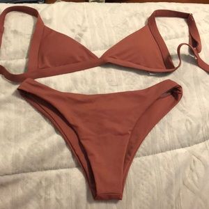 Small Maroon bathing suit.